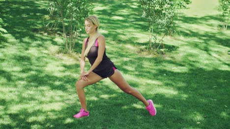 young woman doing stretching squat while warm up before training. fitness woman