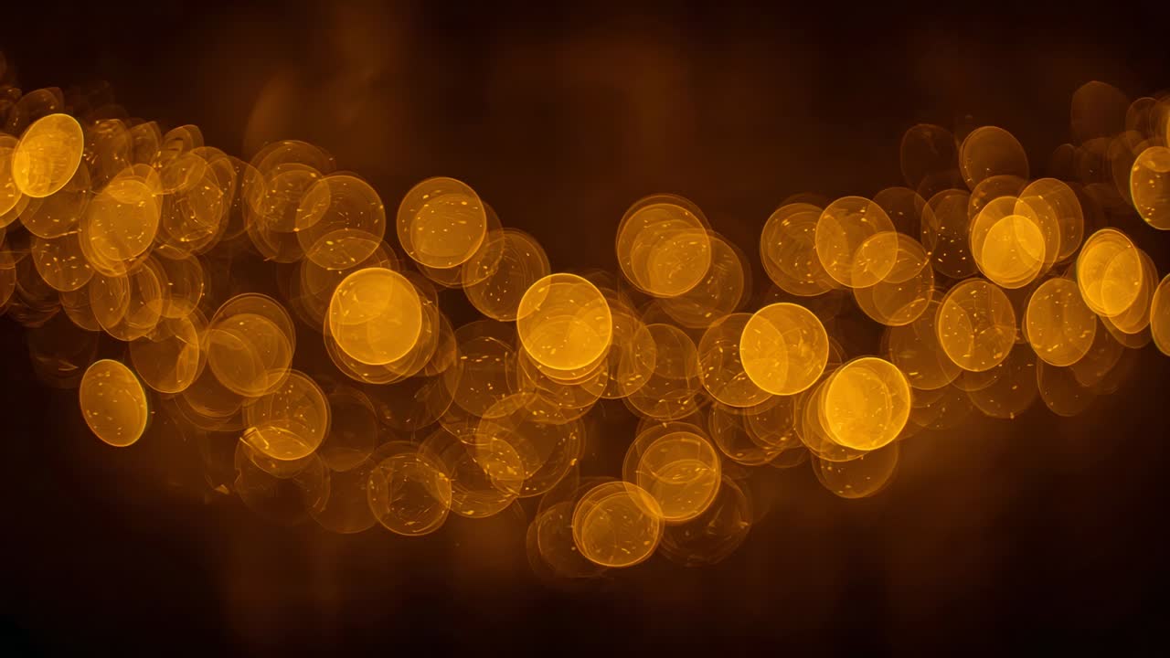 Shimmering cluster of warm amber bokeh orbs shifting in dimly lit room, caused by focus flicker