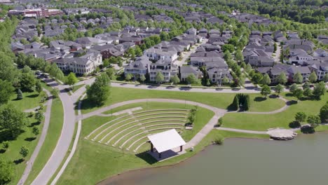 aerial view of the norton commons neighborhood in louisville, kentucky, featuring homes and a small pond. great for real estate, urban design, and regional footage.