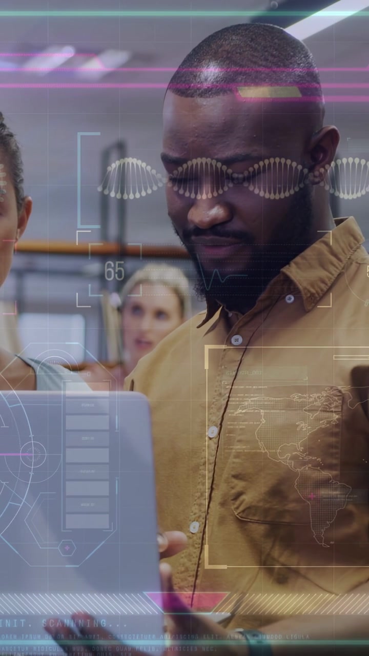 Vertical video: Man tapping pad, activating AR HUD with DNA, analyzing tech data, coworker watching