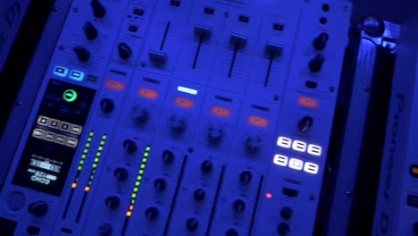 djs controllers in the blue light
