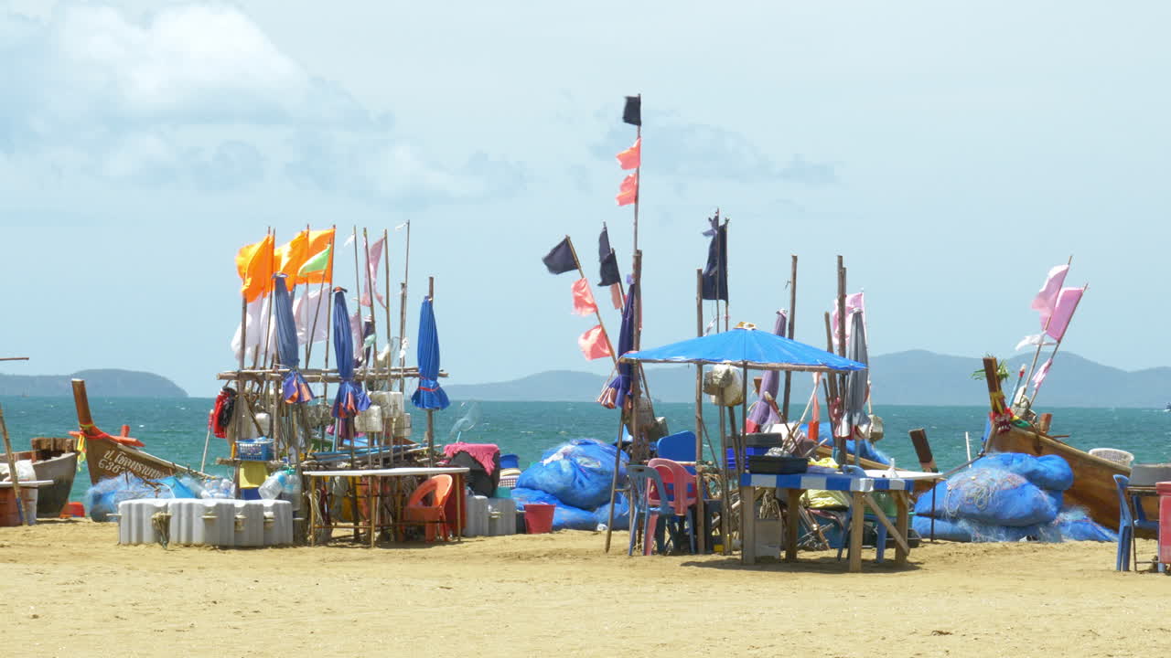 Fishing boats docked at a beachfront facing the Gulf of Thailand in Pattaya, Chonburi province in Thailand
