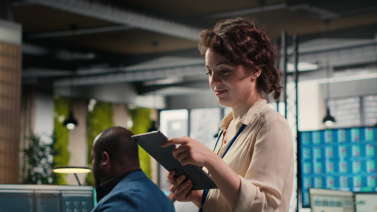 Vertical Video Pensive woman business leader does forecasting on her tablet in the office