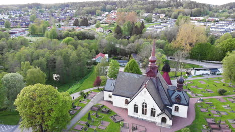 4k aerial footage overhead looking down at church in lerum, town in vastra gotaland, sweden