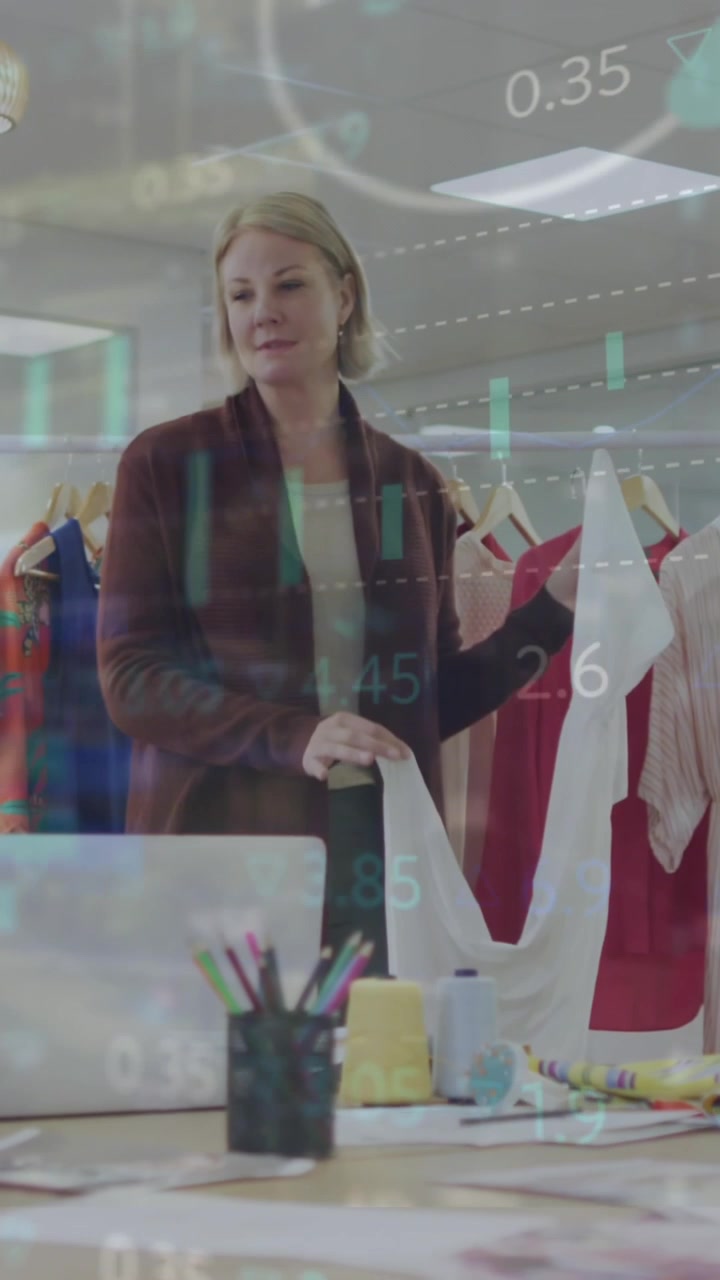 Animation of financial data and graphs over diverse businesspeople in office