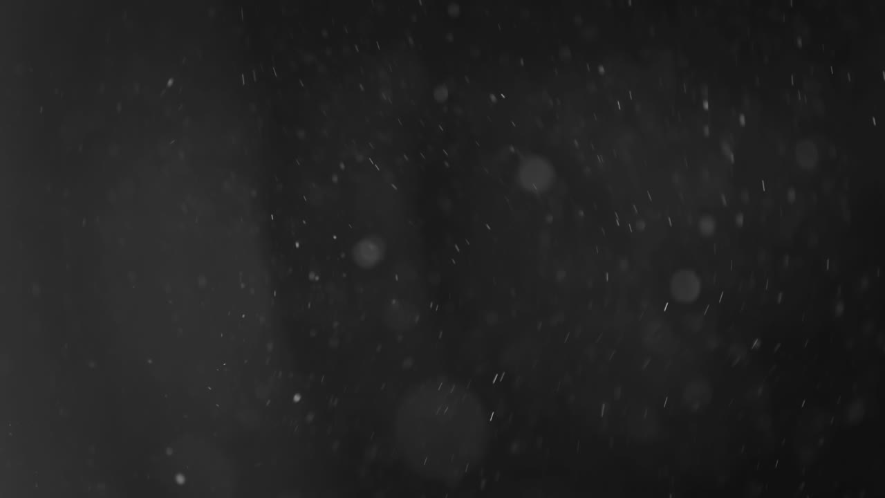 어두운 배경에 떠 있는 추상 입자 보케