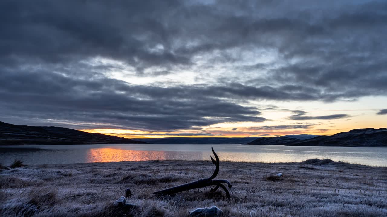 Cloudy sunrise time lapse with pink, orange, dark blue colour, Iceland
