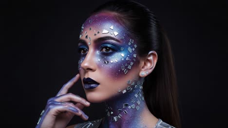 a futuristic portrait of cosmic beauty: stunning face art with celestial vibes and glittering details illuminating the model's unique features and expressions