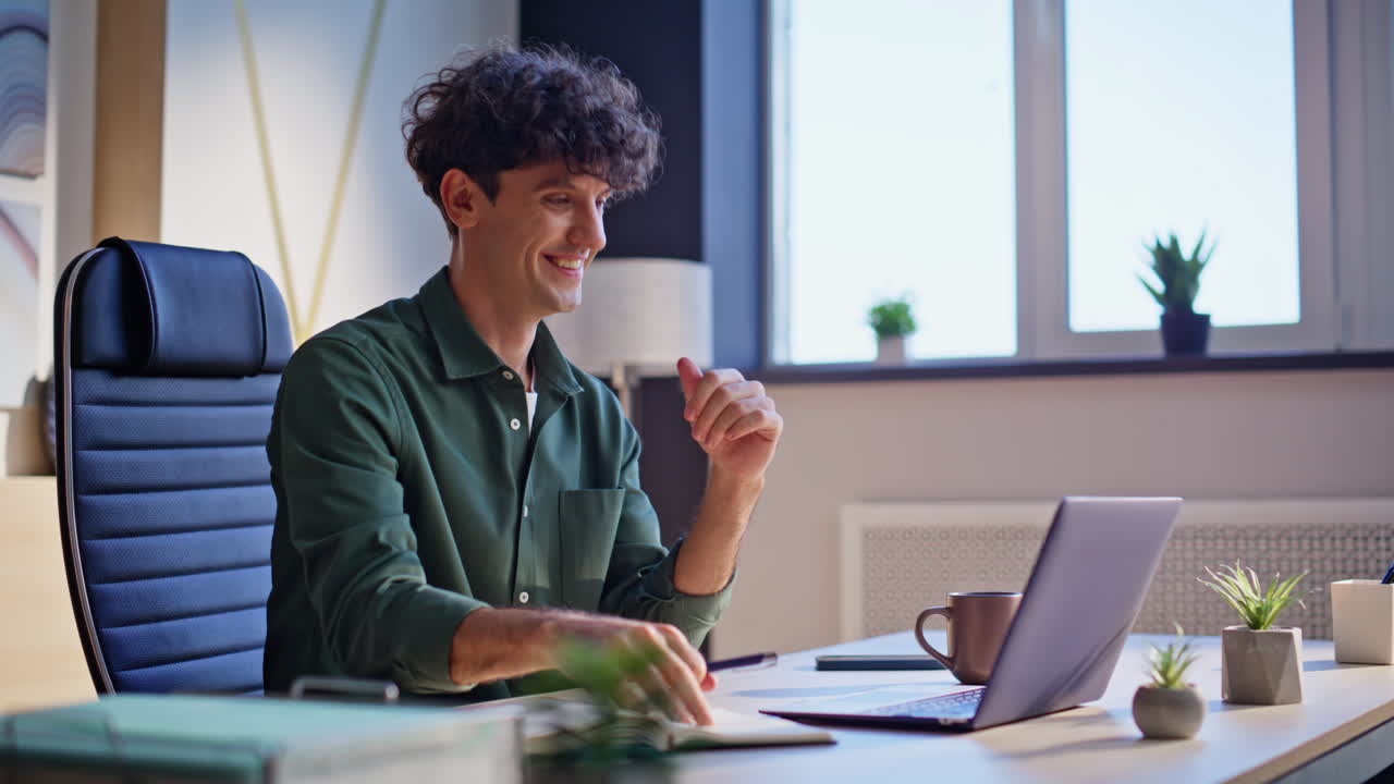 Entrepreneur talking web chat sitting workspace looking data in notebook closeup