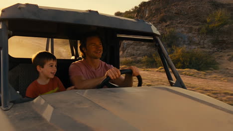 father and son off-road adventure at golden hour