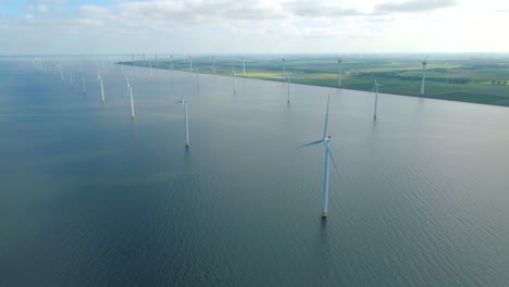 huge windmill turbines, offshore windmill farm in the ocean westermeerwind park , windmills isolated at sea on a beautiful bright day netherlands flevoland noordoostpolder