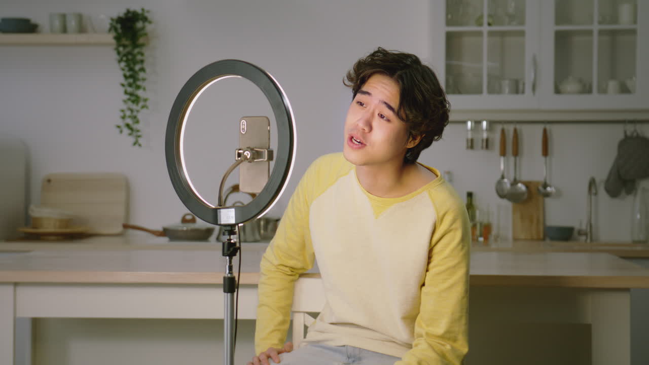 Young Man Recording a Video in Kitchen