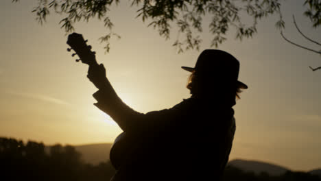 sunset silhouette of a person by the river