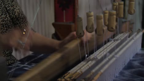 woman weaving silk