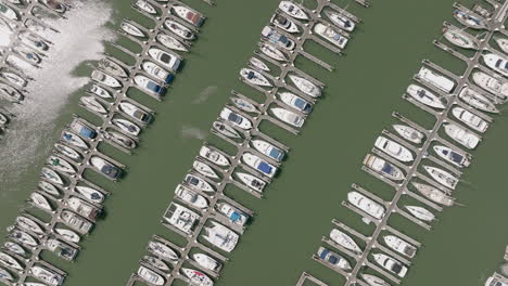 Aerial-top-down-shot-of-boats-in-harbor-and-docks