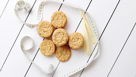 healthy oatmeal cookies on white wood background  top view