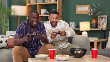 two friends gaming at home