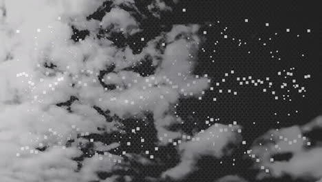 animation of clouds and white dots moving on black background