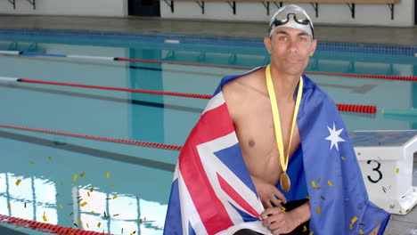 animation of confetti over biracial male swimmer with medal holding flag of australia