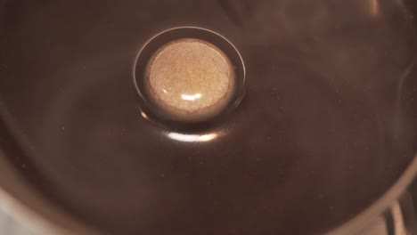 Macro-Shot-Of-Hot-Coffee-With-Steam-In-A-Moka-Pot