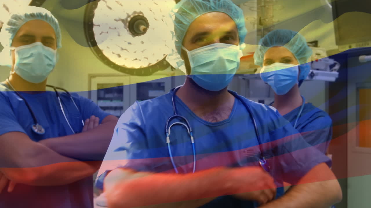 Animazione della bandiera della Colombia che sventola sopra chirurghi in sala operatoria