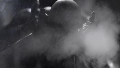 animation of scratches, smoke and red light over scary zombie in corridor holding head in pain