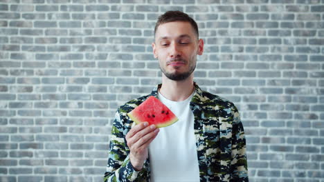 man eating watermelon