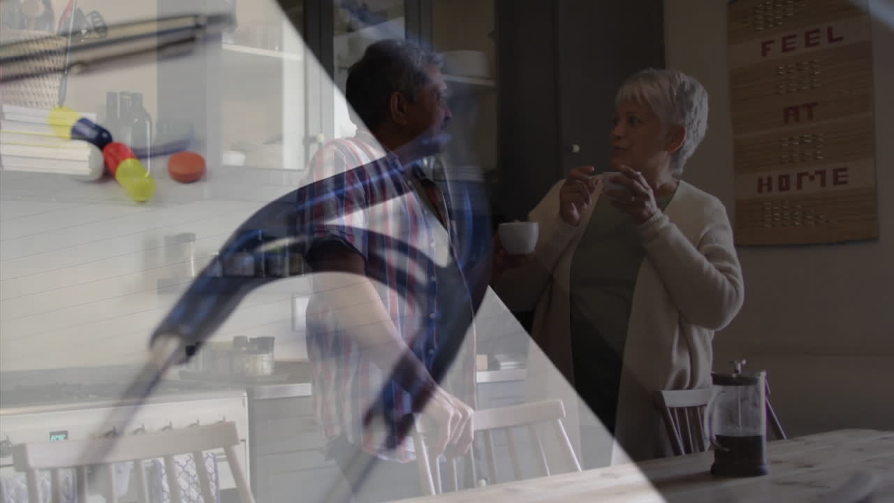 estetoscopio y jeringa girando contra una pareja afroamericana bebiendo café juntos en casa