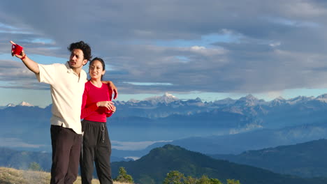 drone shot captures couple spending romantic time together while camping on the hills of sailung, dolakha, nepal