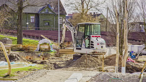 Time-lapse-of-man-and-machine-renovating-the-outdoor-garden