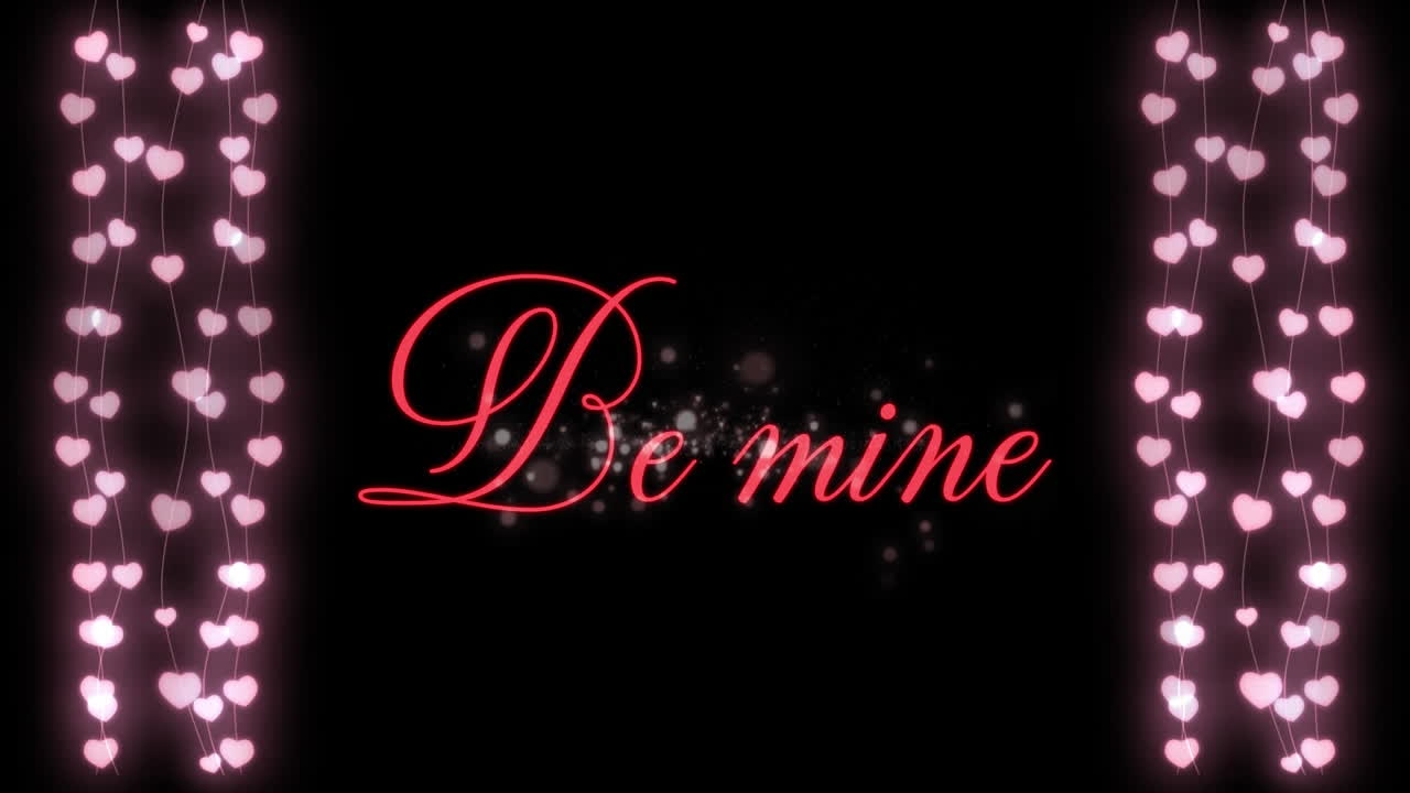 검은색 바탕에 두 개의 심장 꽃걸이와 함께 빨간 글자로 쓰여진 be mine의 애니메이션