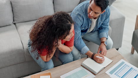 Couple,-writing-and-documents-in-finance-on-sofa