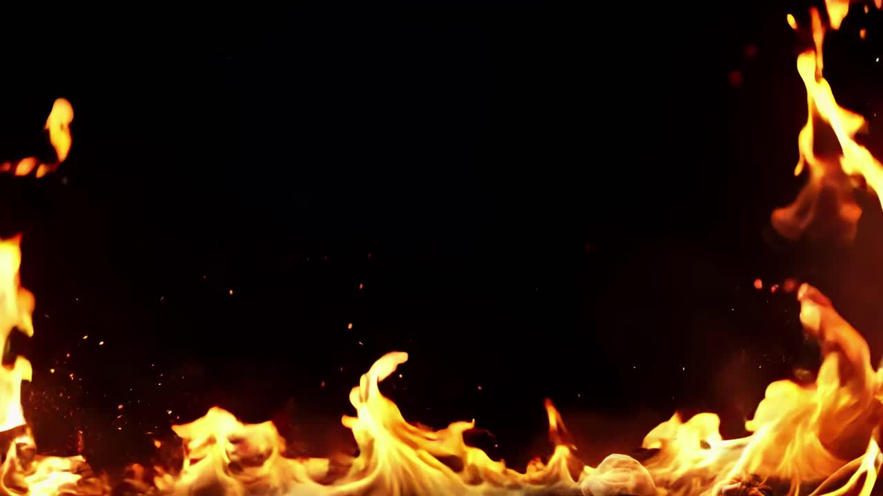 Dynamic video of flames against a black background, captured from a low angle