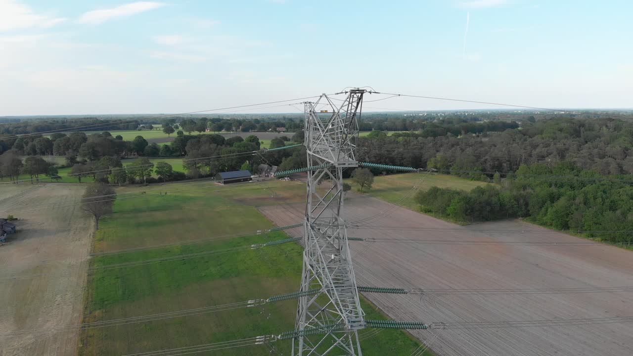 Pylon transmission tower, aerial view of power lines in countryside