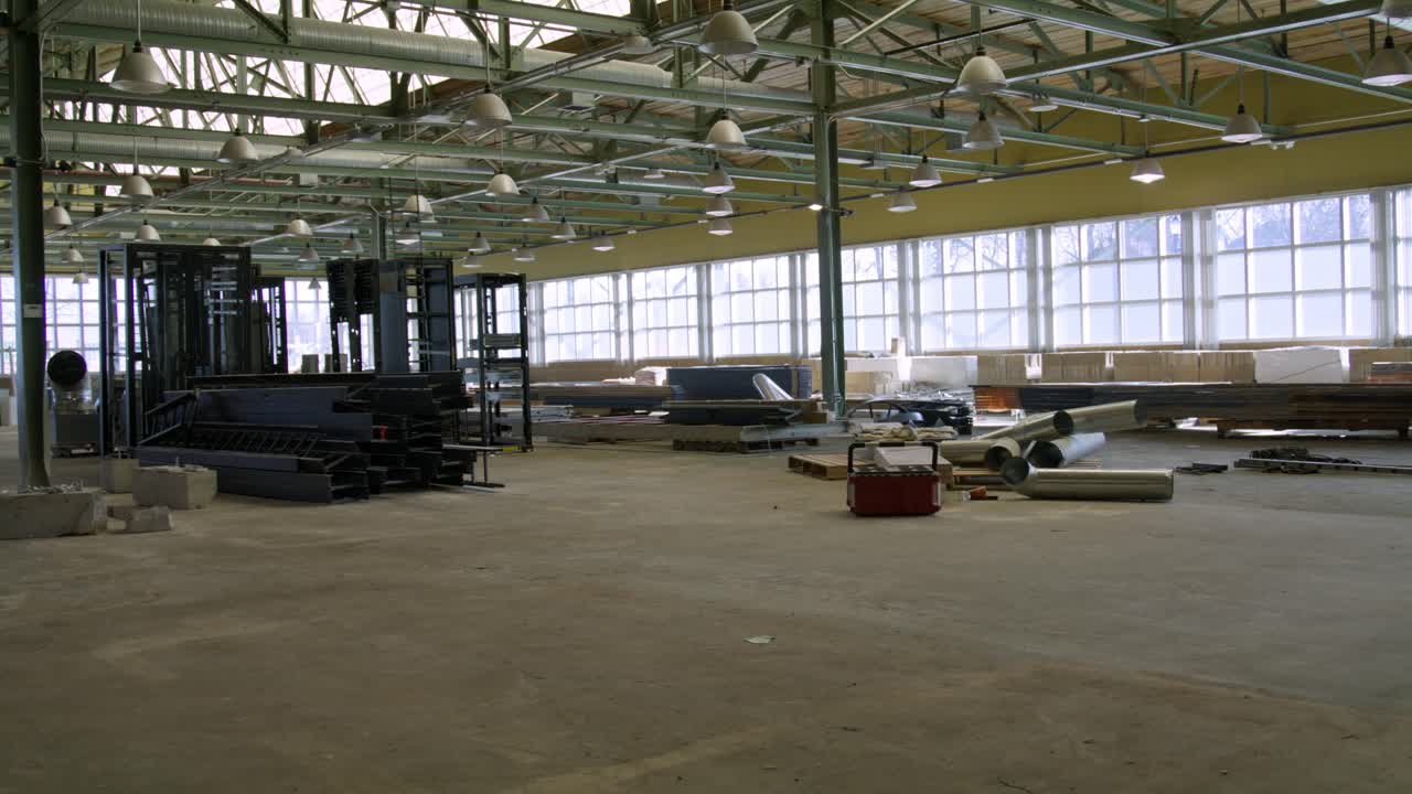 Industrial warehouse under construction with video dolly left to right.