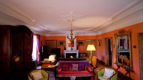 elegant living room with ornate ceiling and chandelier