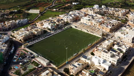 Aerial-View-Over-Soccer-Field-In-Dingli,-Malta---drone-shot