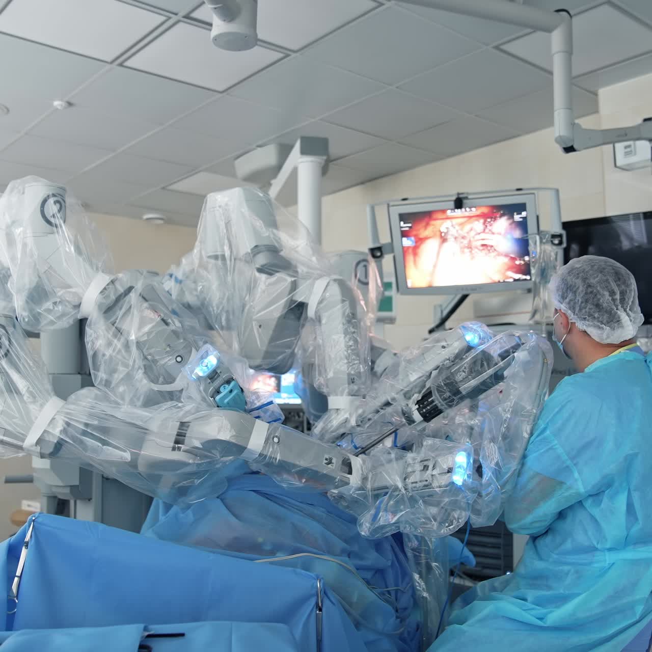 Surgeons performing robotic surgery. Medicine surgical machine with robot surgical system in hospital