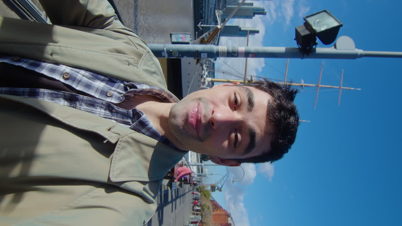 Blogger Showing City and Talking on Camera Outdoors