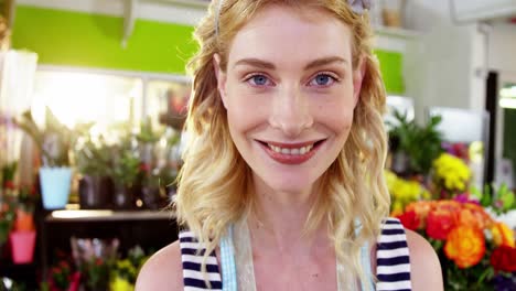 portrait of female florist smiling in flower shop