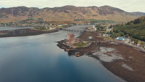 drone shot of medieval eilean donan medieval castle in scotland