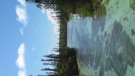 Isle-of-Pines-at-Oro-Bay-the-shallow-channel-between-small-islands-near-the-Natural-Pool---vertical-aerial