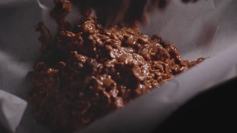 Putting-chocolate-batter-into-cake-pan,-baking-a-chocolate-oat-cake---Steady-Shot