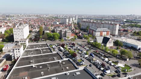 aerial drone view of a shopping mall parking lot in the paris suburbs on a sunny day - france