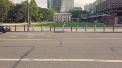 vertical camera movement over philadelphia street until town hall comes into full view with park in the usa