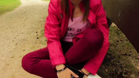 Girl-with-red-jacket-sitting-in-the-park