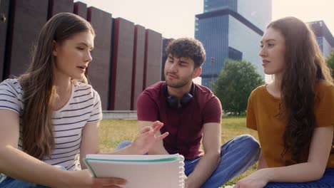 Group-of-caucasian-students-studying-outside-the-university-campus