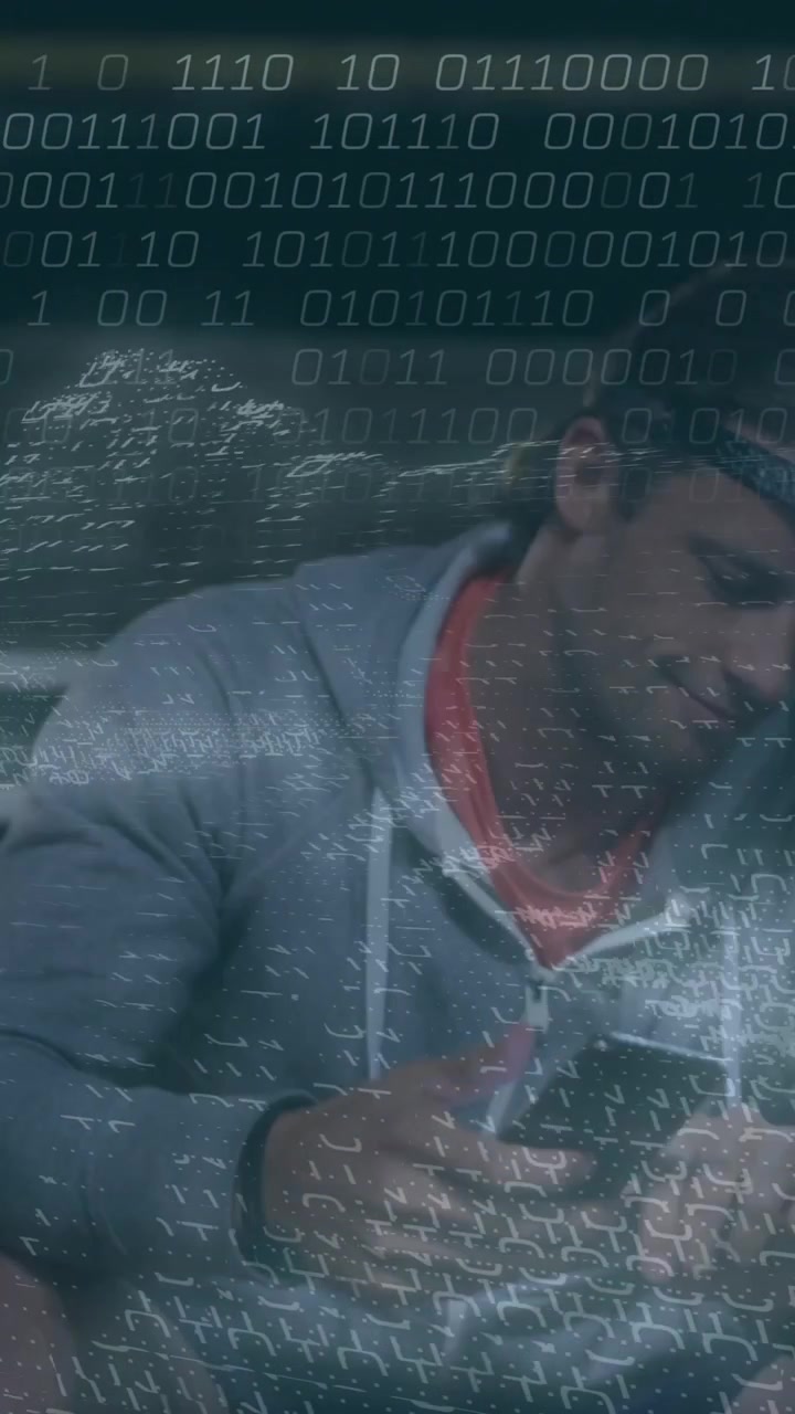 Sitting on stairs, man using digital device with animation of binary code