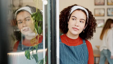 woman looking out cafe window