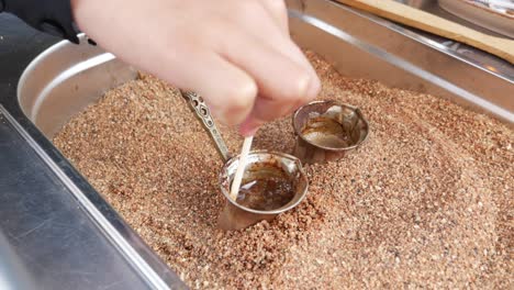 turkish coffee brewing in sand